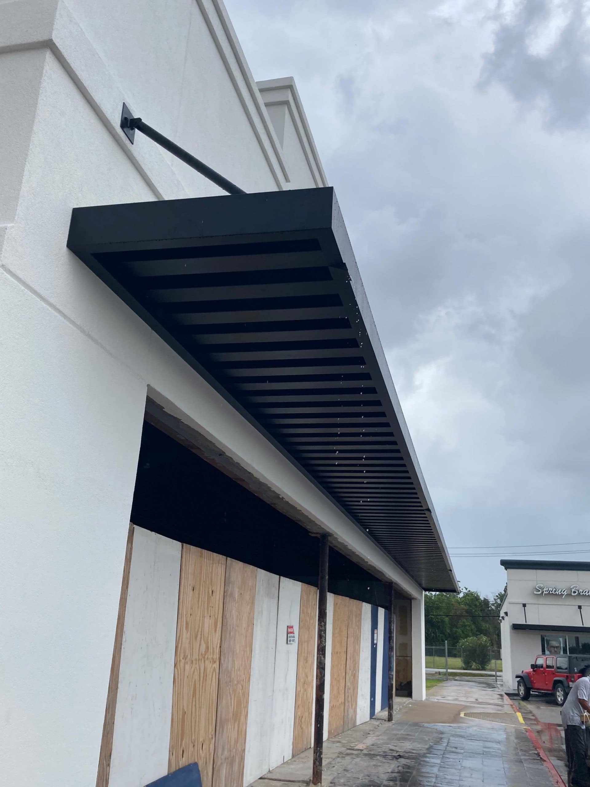 Custom extruded aluminum awnings, walkway covers & canopies — Commercial-grade extruded aluminum systems engineered for long service life. Fabricated and installed by AAA Awning Co., Houston Texas.