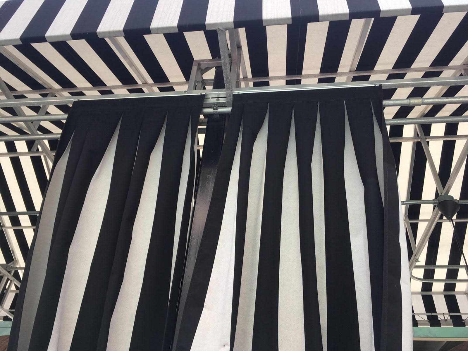 Custom patio curtains — Canvas, vinyl, and shade-cloth curtains for patios and porches. Fabricated and installed by AAA Awning Co., Houston Texas.