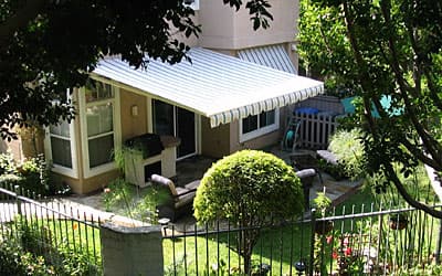 Custom retractable awnings — Motorized and manual retractables — shade on demand, out of sight when you want sun. Fabricated and installed by AAA Awning Co., Houston Texas.